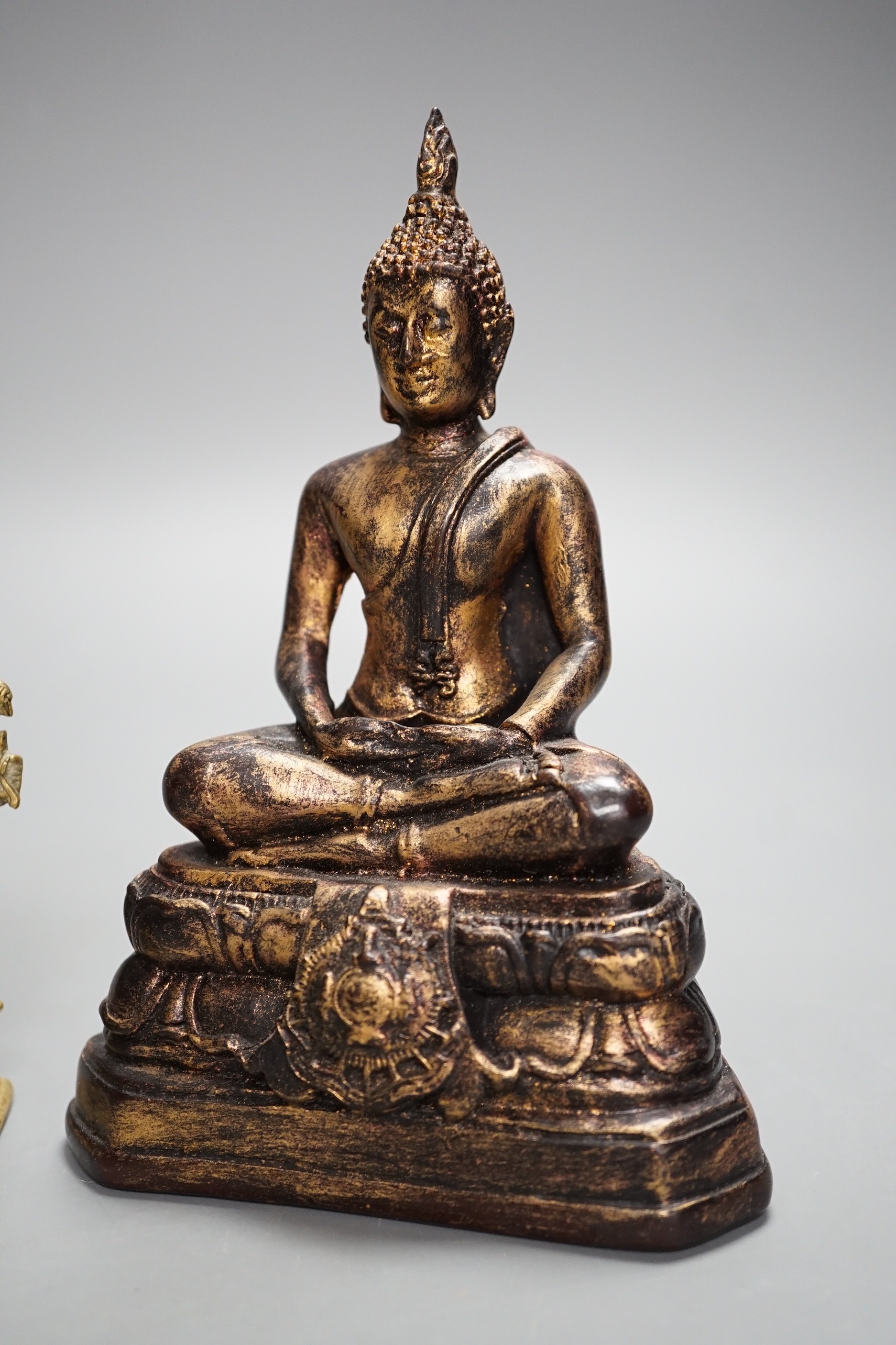 A Thai gilt resin model of Buddha, an Indian bronze model of Ganesh, a jadeite coloured carving of Guanyin and two other figures. Tallest 30cm